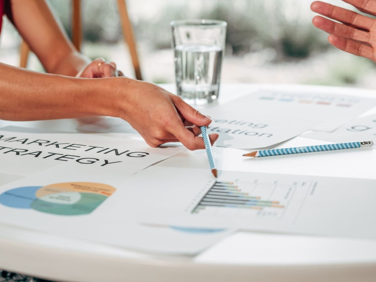 Team reviewing campaign performance charts on a desk