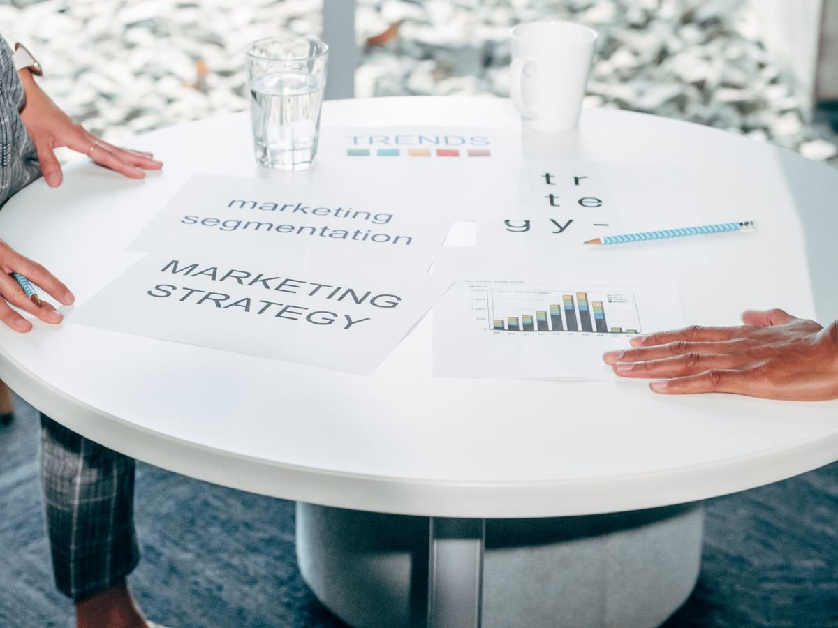 Two colleagues agreeing working terms across a desk