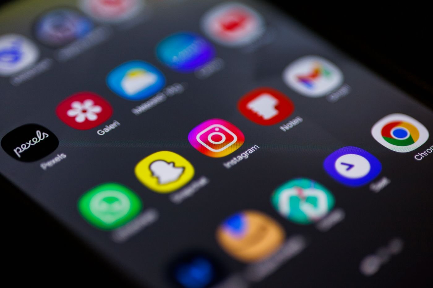 Smartphone home screen showing Instagram and other social apps